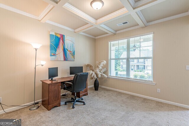 carpeted home office featuring beamed ceiling, crown molding, and coffered ceiling