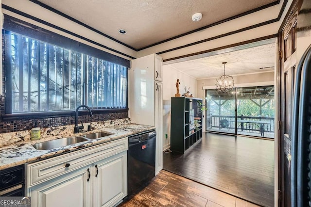 kitchen with dishwasher, dark hardwood / wood-style flooring, white cabinetry, and sink