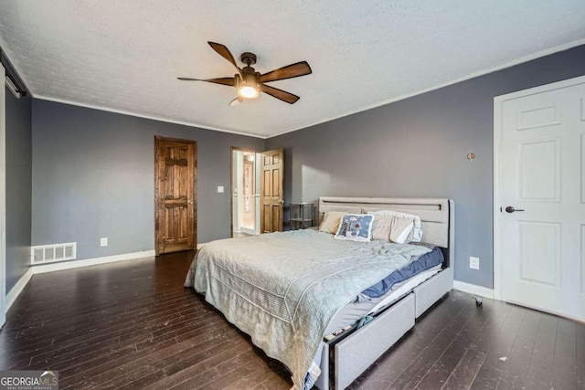 bedroom featuring ceiling fan, dark hardwood / wood-style flooring, and a textured ceiling