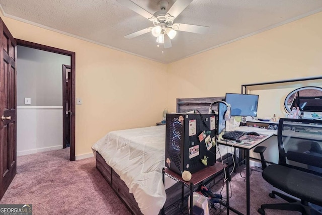 carpeted bedroom with a textured ceiling, ceiling fan, and ornamental molding