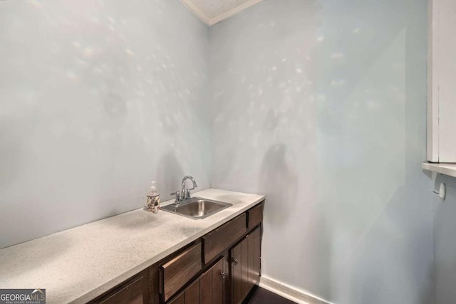 bathroom featuring vanity and crown molding