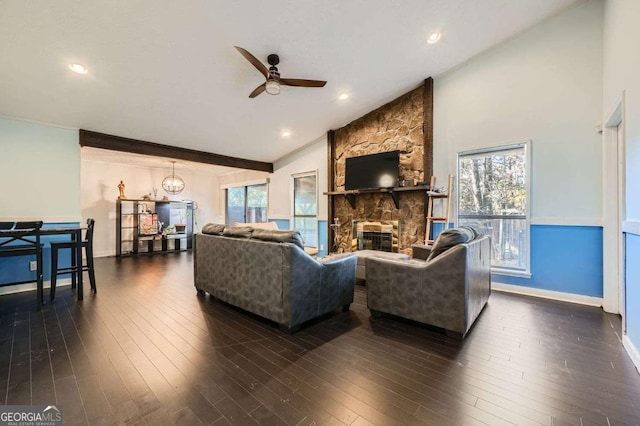 living room featuring lofted ceiling, crown molding, ceiling fan, a fireplace, and dark hardwood / wood-style flooring