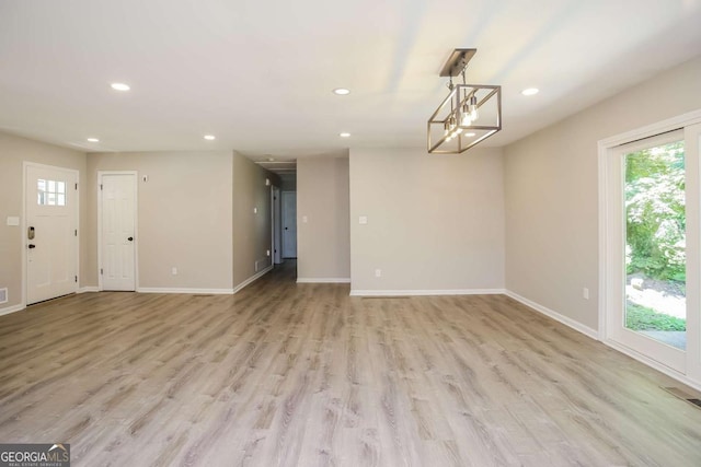 unfurnished living room with light hardwood / wood-style floors