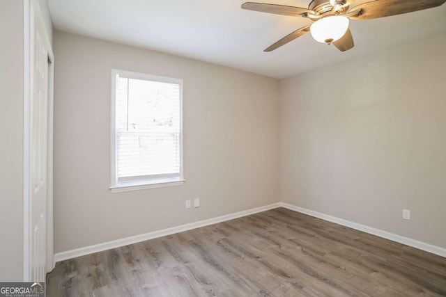 unfurnished room featuring ceiling fan and wood-type flooring