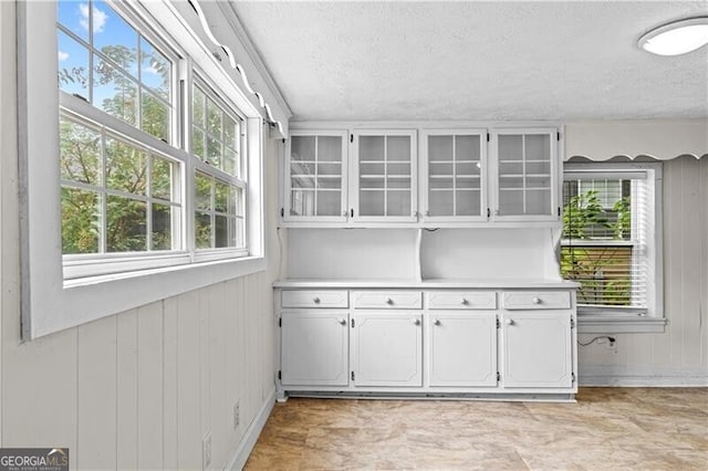 interior space with hardwood / wood-style floors and tile walls