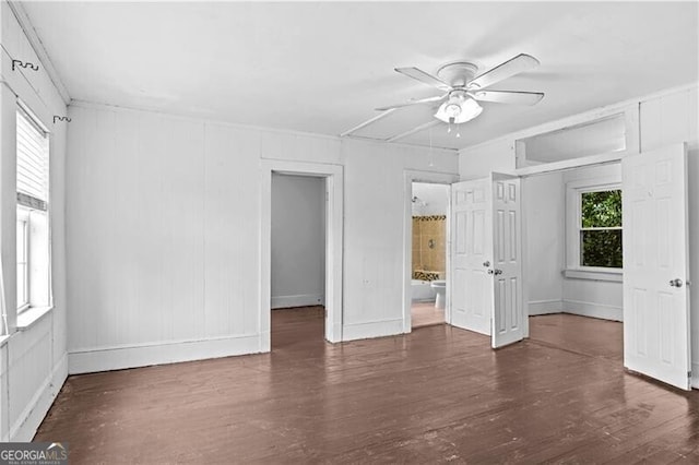 unfurnished living room with a brick fireplace, light hardwood / wood-style floors, ornamental molding, and a notable chandelier