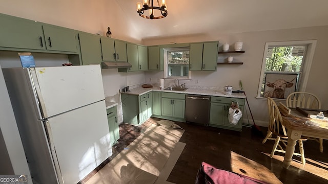 kitchen featuring a wealth of natural light, stainless steel dishwasher, green cabinetry, and white refrigerator