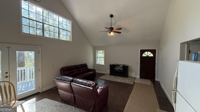 living room with ceiling fan and high vaulted ceiling