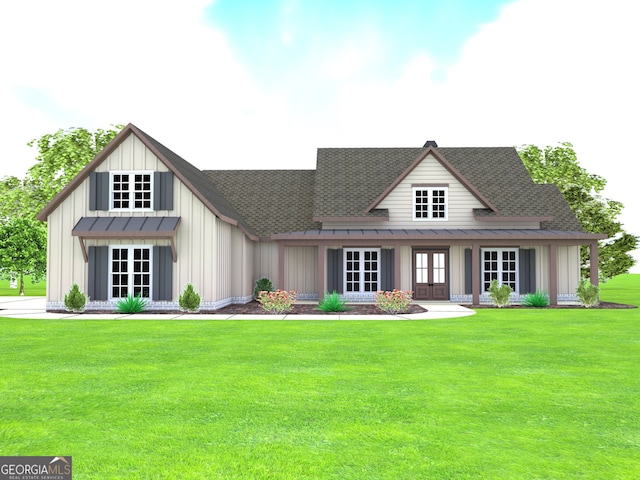 view of front facade featuring a front yard and french doors