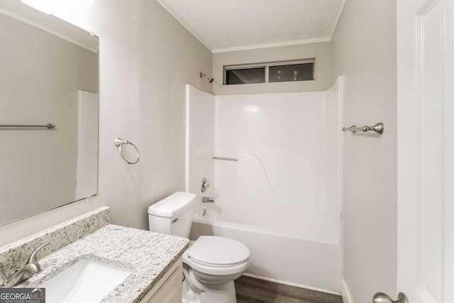 full bathroom with vanity, bathing tub / shower combination, crown molding, toilet, and wood-type flooring