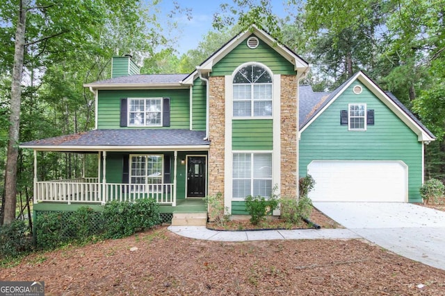 view of front of house featuring covered porch and a garage