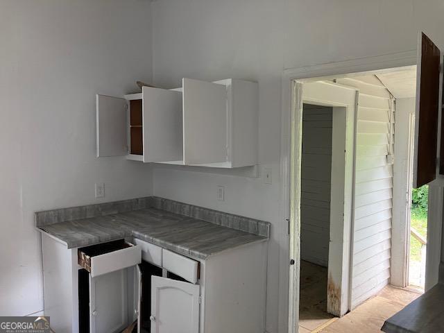 kitchen featuring white cabinets