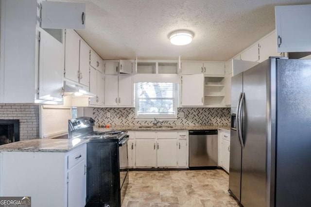 kitchen with stainless steel appliances, white cabinetry, and sink