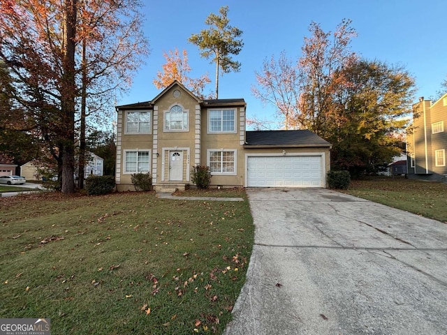 5830 Burdett Rdg, Atlanta, GA 30349 - view of front of property featuring a garage and a front yard