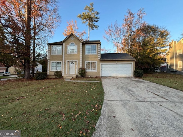 view of front of property featuring a garage and a front yard