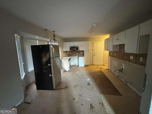 5830 Burdett Rdg, Atlanta, GA 30349 - kitchen featuring backsplash, white cabinetry, stainless steel appliances, and a notable chandelier