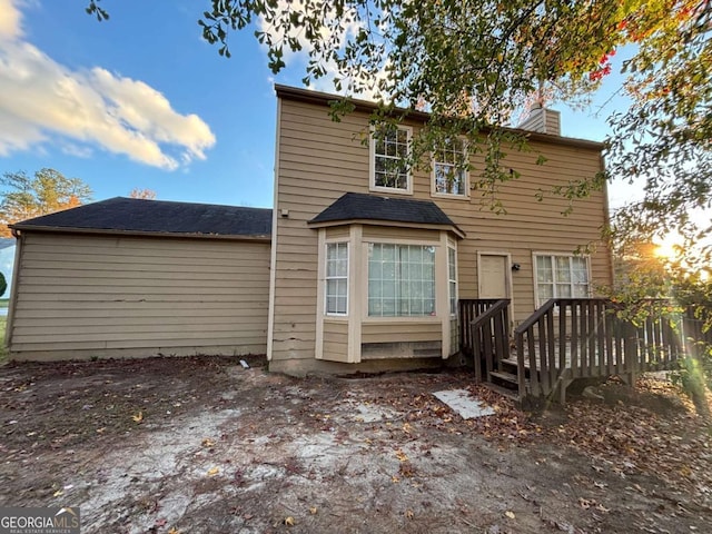 5830 Burdett Rdg, Atlanta, GA 30349 - back house at dusk with a wooden deck