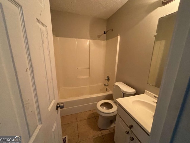 5830 Burdett Rdg, Atlanta, GA 30349 - full bathroom featuring tile patterned floors, a textured ceiling, toilet, vanity, and bathtub / shower combination