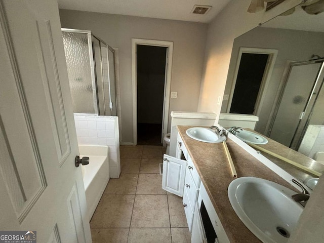 5830 Burdett Rdg, Atlanta, GA 30349 - full bathroom with toilet, vanity, tile patterned floors, and plus walk in shower