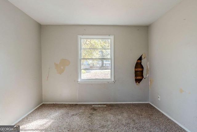 empty room with carpet flooring