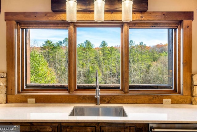 details featuring dishwashing machine and sink