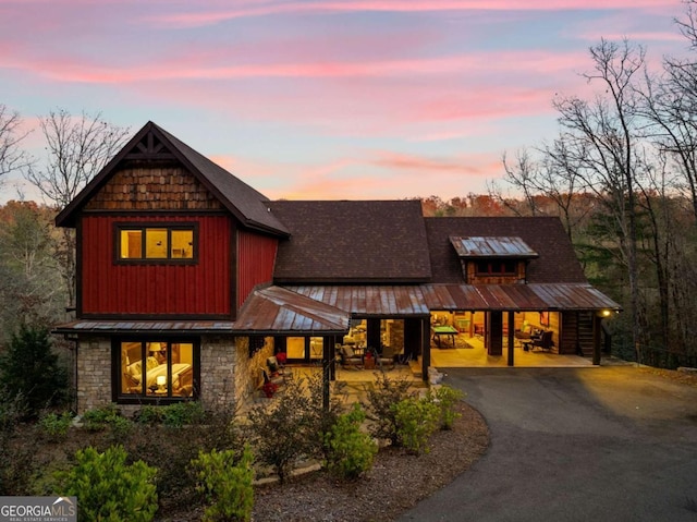 view of front of property featuring a carport