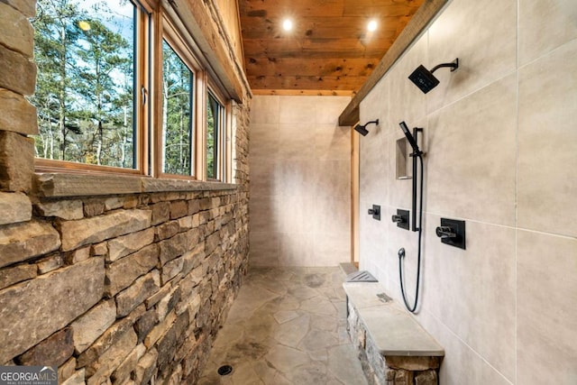 bathroom featuring wooden ceiling and walk in shower