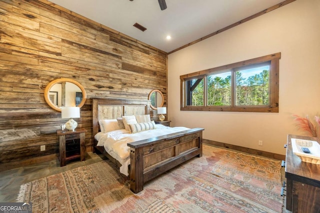 bedroom featuring crown molding, ceiling fan, and wooden walls