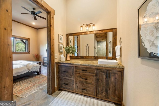 bathroom with vanity, crown molding, and ceiling fan