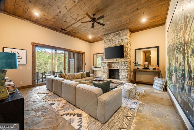 living room with ceiling fan, wooden ceiling, and a fireplace