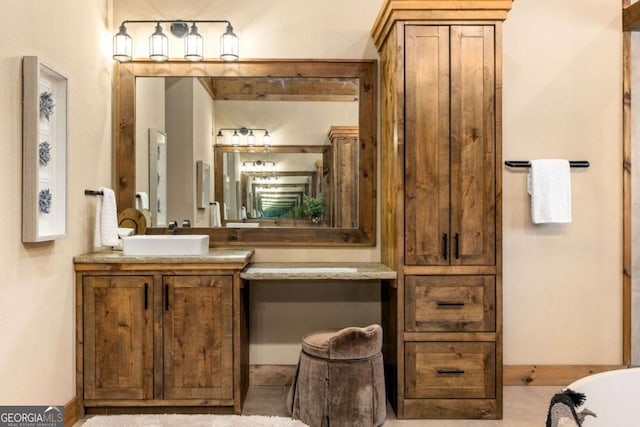 bathroom with a bathtub and vanity