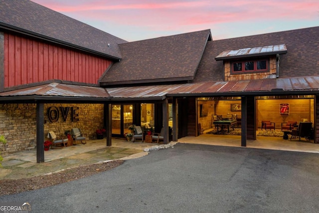 view of back house at dusk