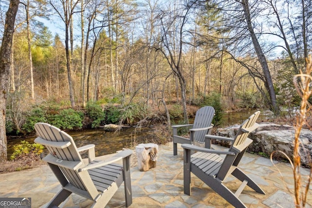 view of patio / terrace with a water view