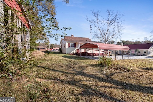 view of yard featuring a carport