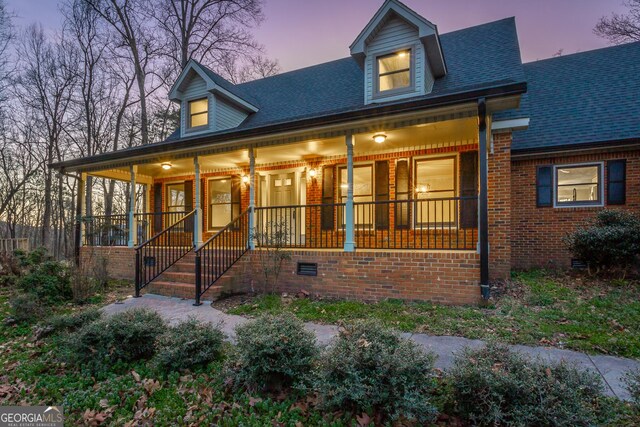 rear view of property featuring a yard and central AC