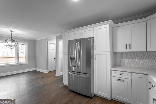 unfurnished living room featuring dark hardwood / wood-style flooring, a brick fireplace, ceiling fan, and crown molding