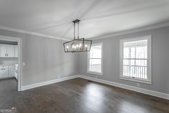 corridor with crown molding and dark hardwood / wood-style flooring