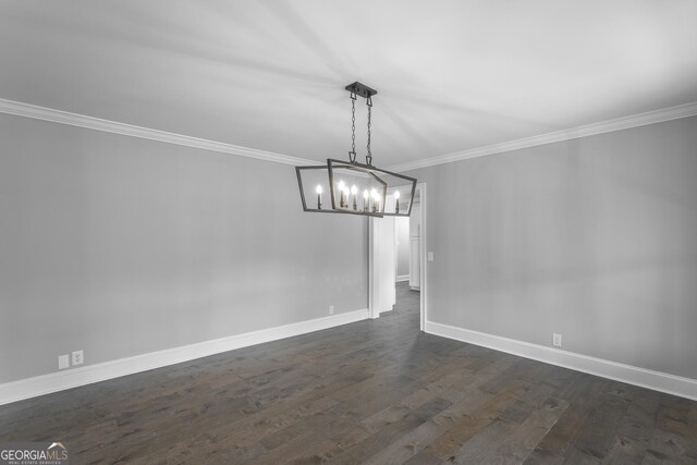 foyer entrance with dark hardwood / wood-style floors and ornamental molding