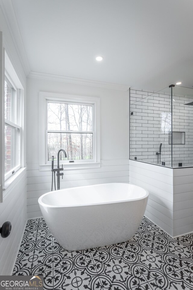 bathroom with tile patterned flooring, vanity, and crown molding