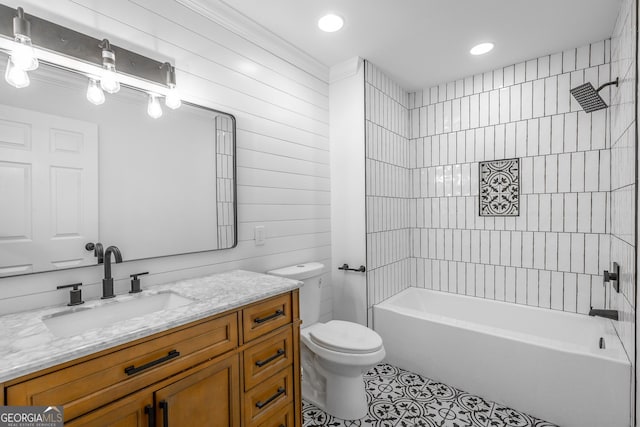 full bathroom featuring tile patterned flooring, vanity, toilet, and tiled shower / bath