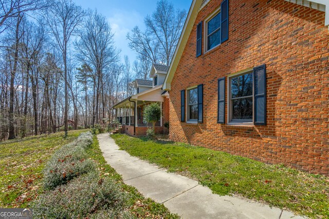 additional living space featuring dark hardwood / wood-style floors and vaulted ceiling