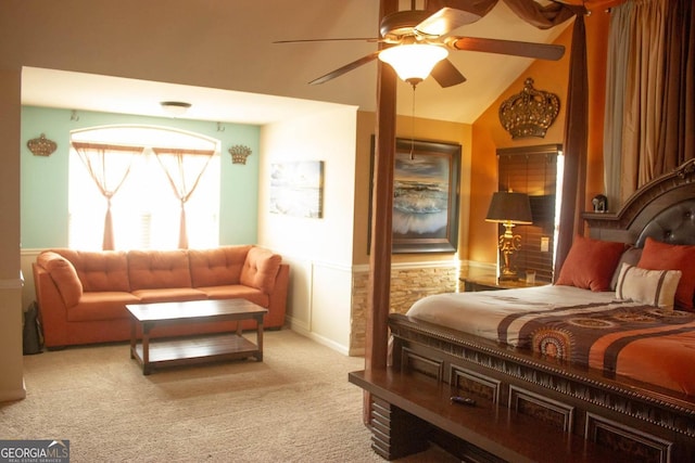 bedroom featuring lofted ceiling, carpet, and ceiling fan