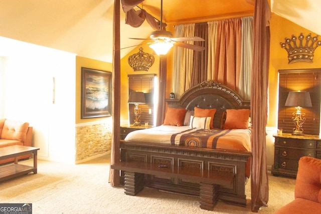 carpeted bedroom with ceiling fan and lofted ceiling