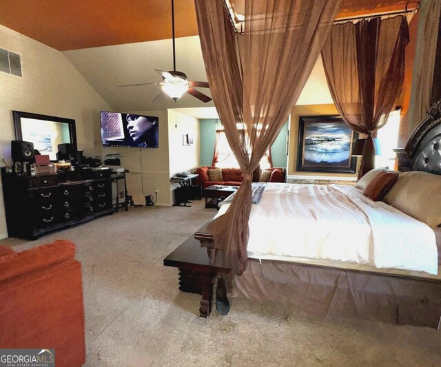 carpeted bedroom featuring vaulted ceiling, multiple windows, a ceiling fan, and visible vents