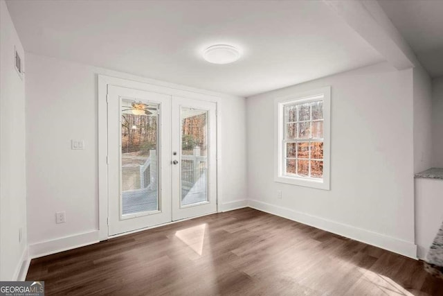 interior space with french doors, dark hardwood / wood-style floors, and ceiling fan