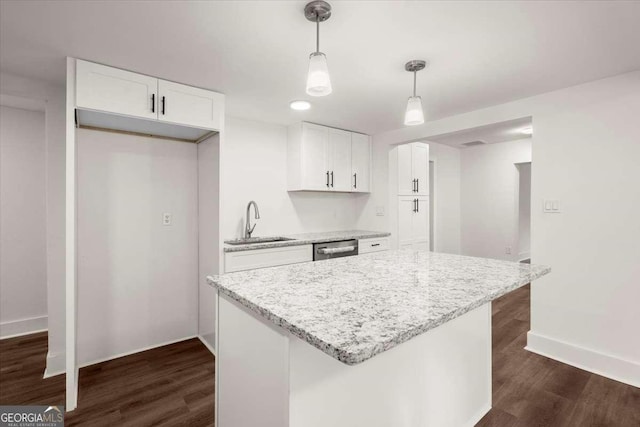 kitchen featuring dark hardwood / wood-style flooring, white cabinetry, and sink