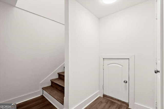 staircase featuring hardwood / wood-style floors