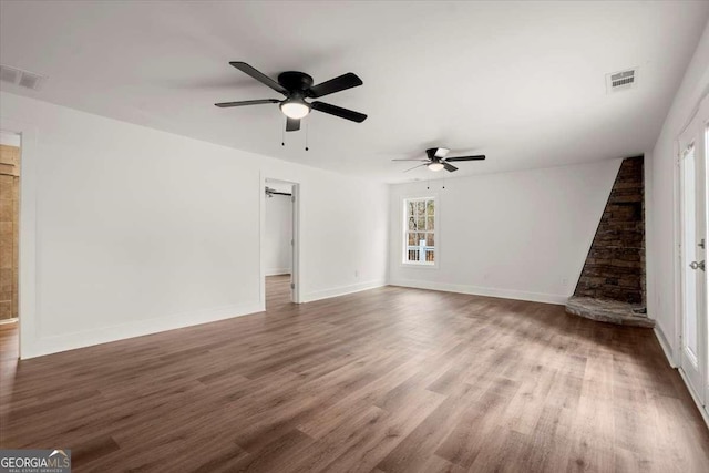 interior space with dark hardwood / wood-style floors and ceiling fan