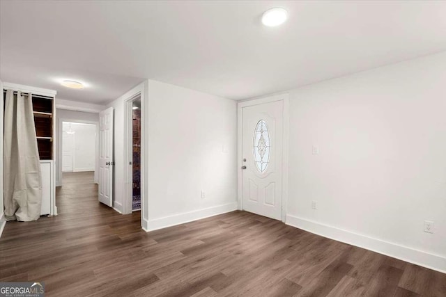 foyer entrance featuring dark hardwood / wood-style floors