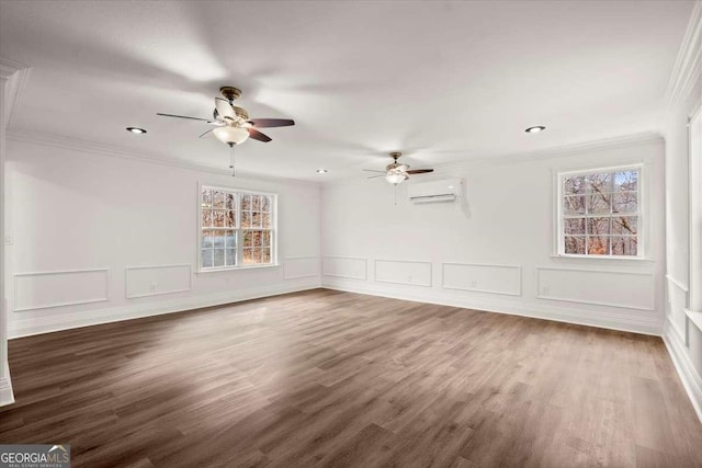 unfurnished room with dark hardwood / wood-style flooring, a wall unit AC, ceiling fan, and ornamental molding